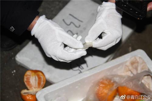 男子通過橘子縫塞進毒品 被快遞小哥識破