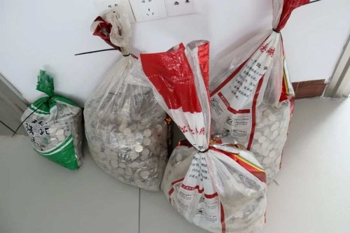 “攜硬幣清償被法院罰5萬”當事人:已遞交復議申請